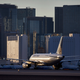 A plane taxis toward the terminal after landing at McCarran International Airport in Las Vegas.